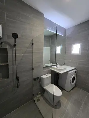 a bathroom with a toilet and a sink at Hommory Residence - East Chalong in Phuket Town