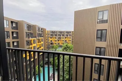 a balcony with a view of some apartment buildings at Mode apartment central Phuket in Phuket Town