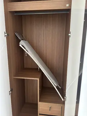 a wooden wardrobe with a surfboard in it at Patong tower sea view in Patong Beach