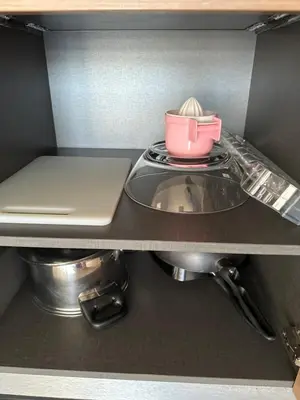a kitchen with a sink and a laptop on a shelf at Patong tower sea view in Patong Beach