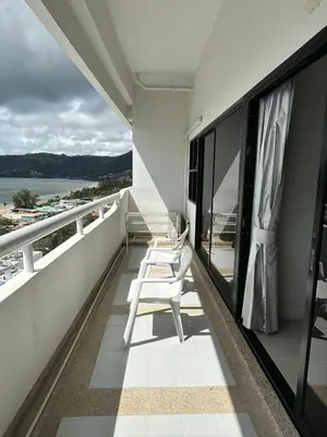 a balcony with chairs and a view of the water at Patong tower sea view in Patong Beach