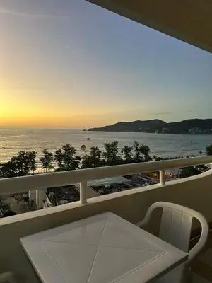 a balcony with a table and a view of the ocean at Patong tower sea view in Patong Beach