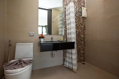 a bathroom with a sink and a toilet at Lively Stay at Vibrant Kata, 4BR Pool Villa B2 near Beach - UTK2 in Kata Beach