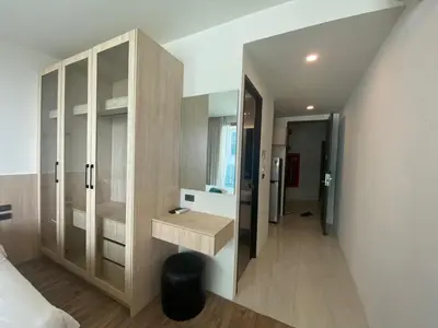 a bathroom with a sink and a large mirror at A43 Oceana kamala in Kamala Beach