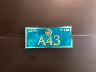 a sign on a door with the number at A43 Oceana kamala in Kamala Beach
