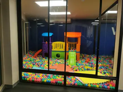 a window with a toy play room with balls at Veloche Karon palm in Phuket Town