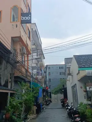 an alley between two buildings with motorcycles on it at XX BAO Patong Beach Phuket 3 in Patong Beach