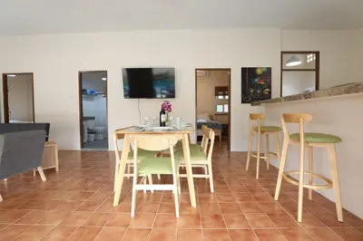 a dining room with a table and chairs at Coral Lagoon Pool Villa Rawai - Adult Only in Rawai Beach