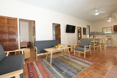 a living room with a couch and a table at Coral Lagoon Pool Villa Rawai - Adult Only in Rawai Beach