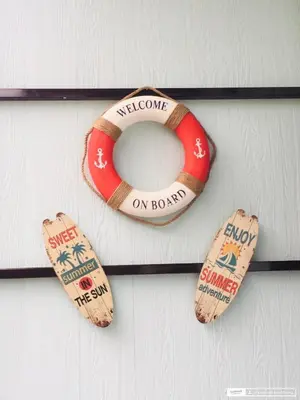 a life vest and a life preserver on a wall at Sunshine guesthouse in Ban Saiyuan (1)