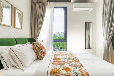a bedroom with a bed and a large window at Title Halo Time for Jungle 40m2 King Bed Pool in Nai Yang Beach