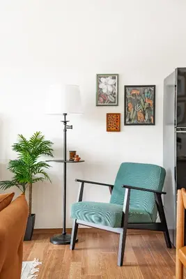 a chair and a lamp in a living room at Title Halo Time for Jungle 40m2 King Bed Pool in Nai Yang Beach