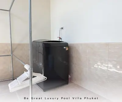 a small bathroom with a shower and a toilet at Luxury Pool Villa 5 mins to Phuket Old Town in Ban Lo Long