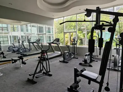 a gym with a bunch of tread machines in it at Golden Manora Hotel Bangtao Beach Phuket in Bang Tao Beach