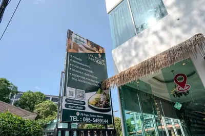 a building with a sign in front of it at Golden Manora Hotel Bangtao Beach Phuket in Bang Tao Beach