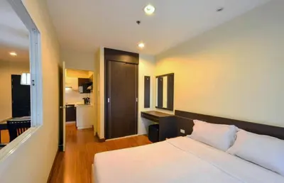 a hotel room with a bed and a bathroom at Phuket Villa Patong in Patong Beach