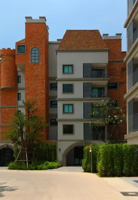 an apartment building with a driveway in front of it at 1 BR apartment in Title Naiyang in Nai Yang Beach
