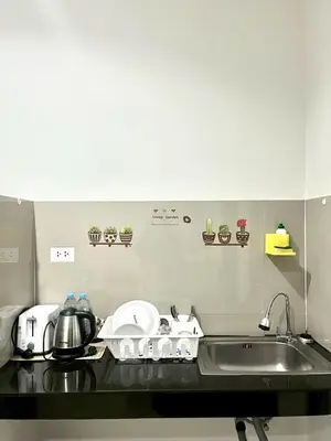 a kitchen with a sink and a counter top with a sink at Yada House s&h in Nai Yang Beach