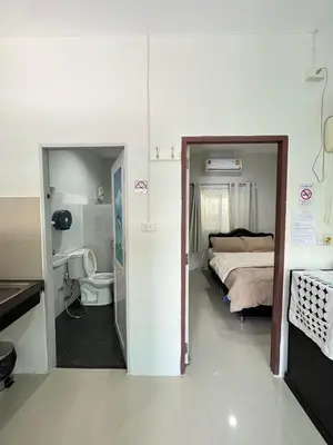 a small bedroom with a bed and a bathroom at Yada House s&h in Nai Yang Beach