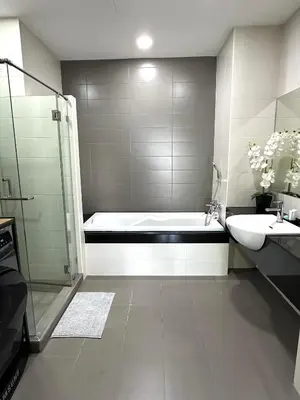 a bathroom with a bath tub and a sink at Apartment Karon SeaView 72 sq in Karon Beach