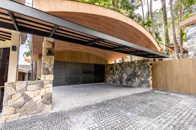 a house with a stone walkway and a stone wall at Sinae Residence in Ban Lo Ti Pa (1)