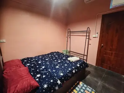 a bedroom with a bed with a star patterned blanket at Bonanza Patong Beach2 for 2 BR 100m to Beach Grace Room in Patong Beach