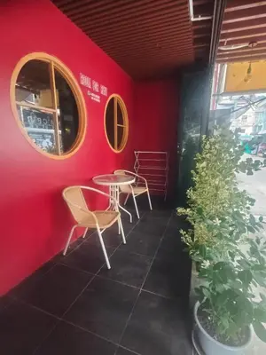 a red room with a table and chairs and a plant at Bonanza Patong Beach2 for 2 BR 100m to Beach Grace Room in Patong Beach