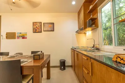 a kitchen with a sink and a counter top at 15 Minuets Walk 2 BangTao Beach Fully Loaded v134 in Bang Tao Beach