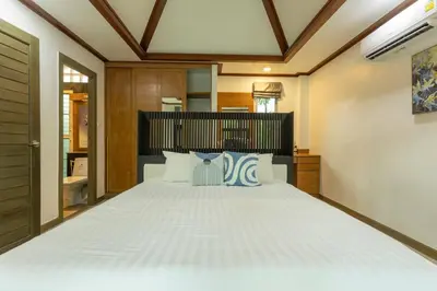 a bedroom with a large white bed in a room at 15 Minuets Walk 2 BangTao Beach Fully Loaded v134 in Bang Tao Beach