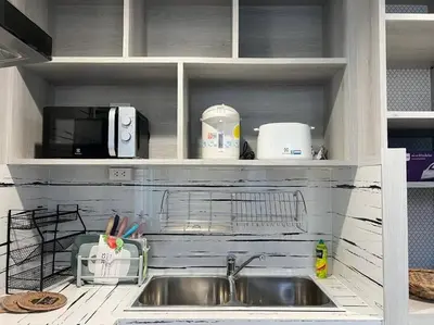 a kitchen with a sink and a microwave at Bang Tao Town House 1km Surin Beach V135 in Thalang