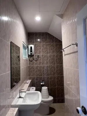 a bathroom with a sink and a toilet at Bang Tao Town House 1km Surin Beach V135 in Thalang