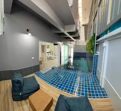 a room with blue tile on the floor of a building at Bang Tao Town House 1km Surin Beach V135 in Thalang