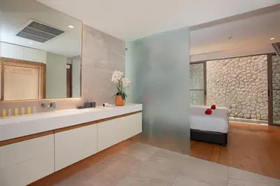 a bathroom with a large mirror and a sink at Sea View 3BR Duplex in The Sapphire Bay 88 Residence near Patong and Paradise Beach in Patong Beach