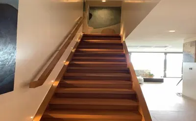 a staircase in a house with wooden floors at Sea View 3BR Duplex in The Sapphire Bay 88 Residence near Patong and Paradise Beach in Patong Beach