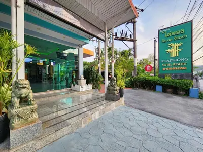 a building with statues in front of a store at Phaithong Sotel Resort in Chalong