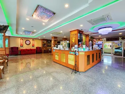 a salon with a counter and a bar in a room at Phaithong Sotel Resort in Chalong