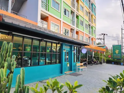 a building on a street with a cactus at Phaithong Sotel Resort in Chalong