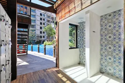 a room with a view of a pool at Apart Pool Access Naiyang Beach in Nai Yang Beach