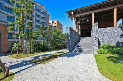 a stone path in front of a building at Apart Pool Access Naiyang Beach in Nai Yang Beach