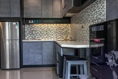 a kitchen with a counter and a refrigerator at Fully Loaded Resort everything You Need #C142 in Kamala Beach