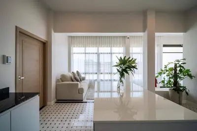 a kitchen and living room with a couch and a table at Pool Villa Alawan Krabi Klong Muang R2 in Klong Muang Beach