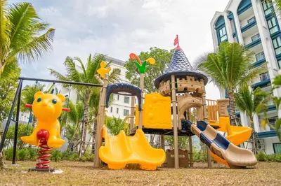 a playground at a resort with a castle and slides at Title Halo Orange Sunset 46m2 Naiyang Pool&Gym in Nai Yang Beach