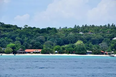a view of a beach with houses and trees at Phi Phi Long Beach Resort & Villa in Phi Phi Don