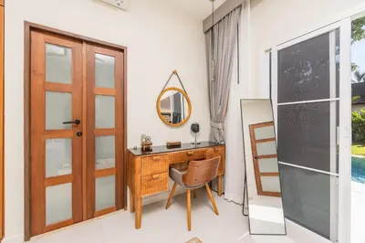 a home office with a desk and a mirror at Kokyang Estate by TropicLook in Nai Harn Beach