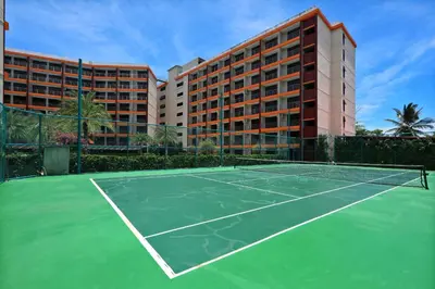 a tennis court in front of a hotel at Studio 777 Condo MaiKhao in Ban Mai Salae