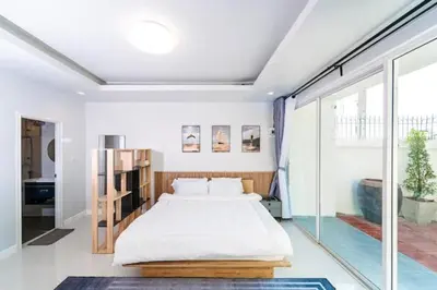 a bedroom with a large bed and a large window at Great sea View Roof Top V163 in Kamala Beach