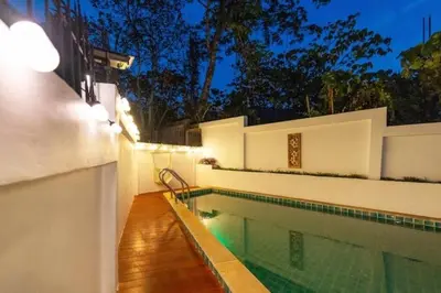 a swimming pool in a house at night at Great sea View Roof Top V163 in Kamala Beach