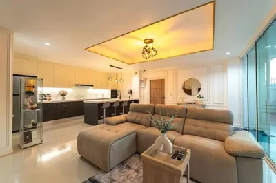 a large living room with a couch and a kitchen at Great sea View Roof Top V163 in Kamala Beach