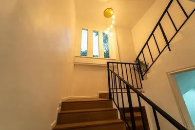 a staircase in a home with a stair case at Great sea View Roof Top V163 in Kamala Beach