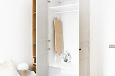 a room with white walls and a closet with shelves at Title Halo I Sea You Naiyang Pool Gym Sauna in Nai Yang Beach